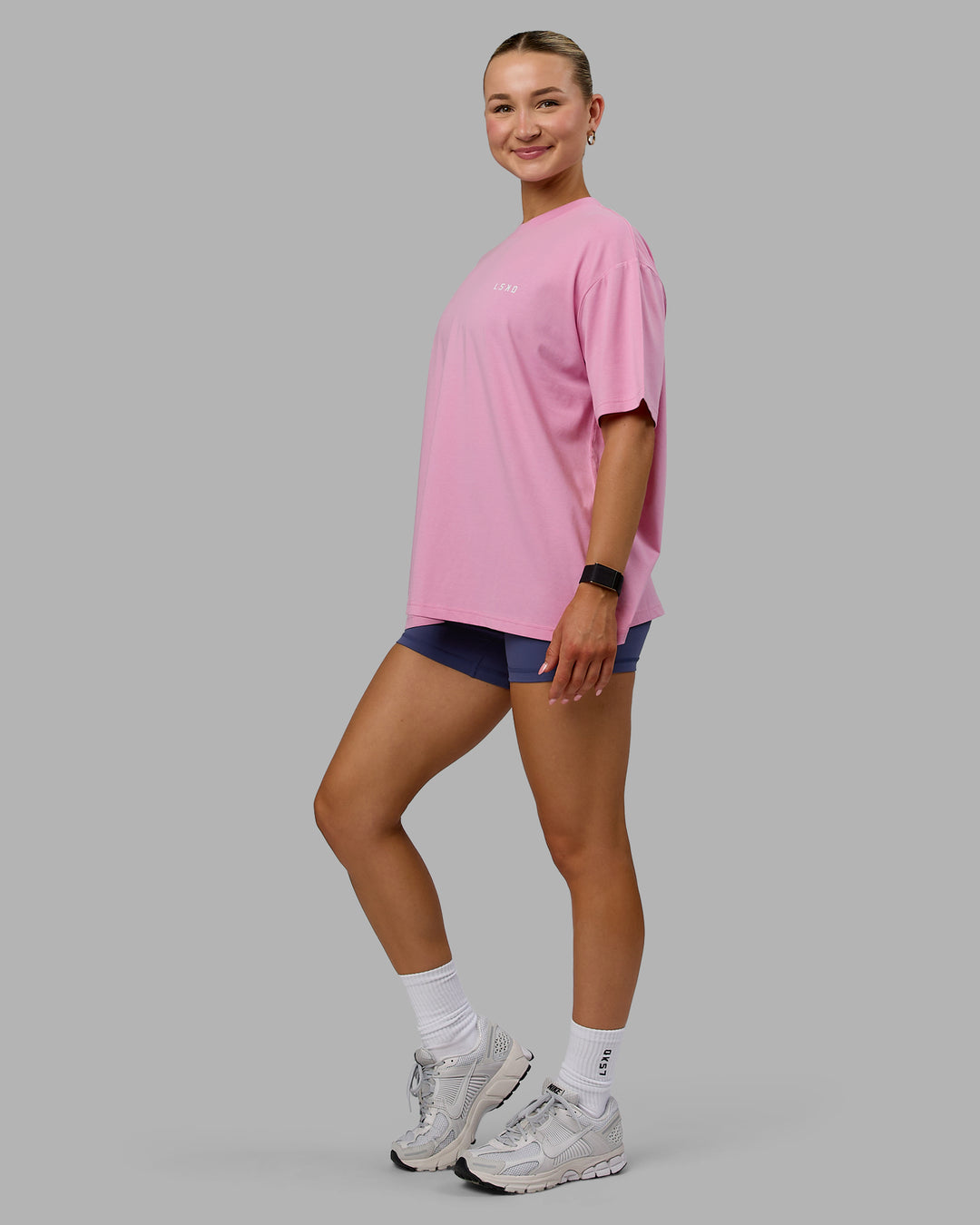 Woman wearing Go-To We Rise FLXCotton Oversized Tee - Bubblegum-White