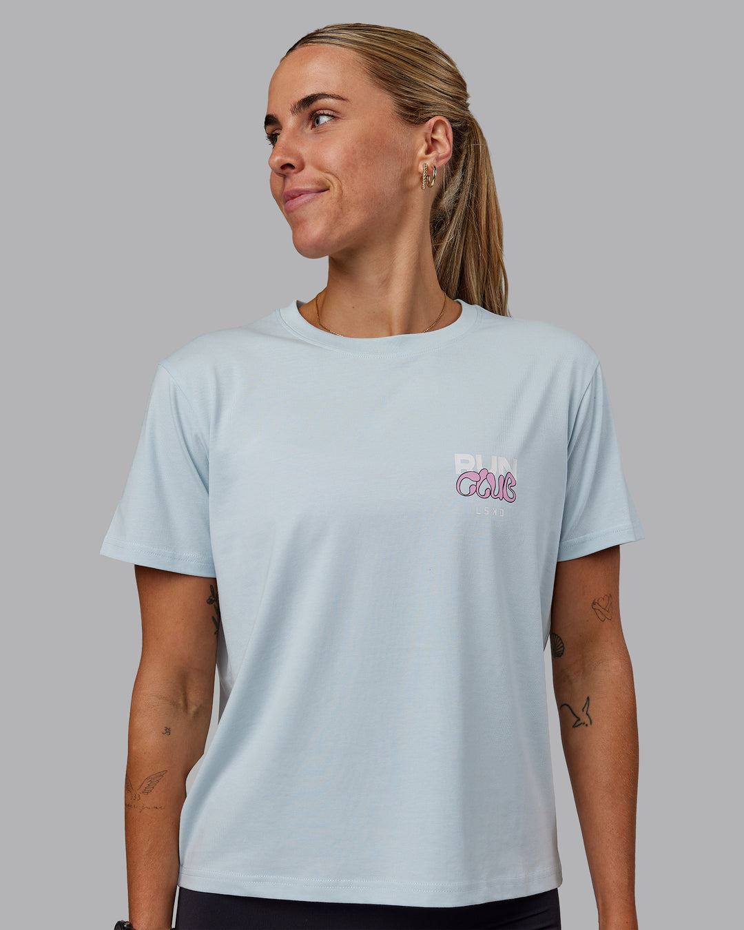 Woman wearing Gone Running FLXCotton Tee - Skyride-Bubblegum