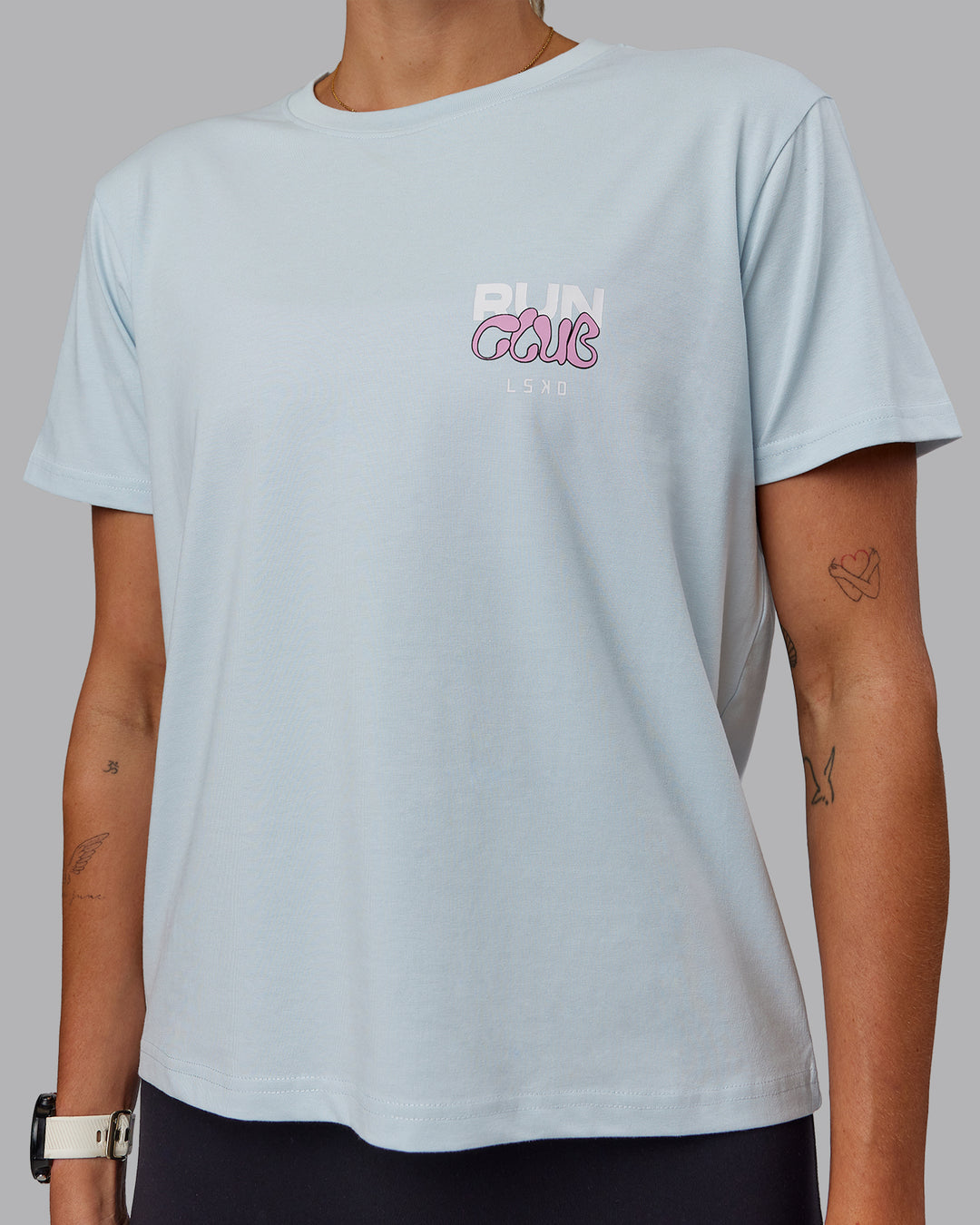 Woman wearing Gone Running FLXCotton Tee - Skyride-Bubblegum