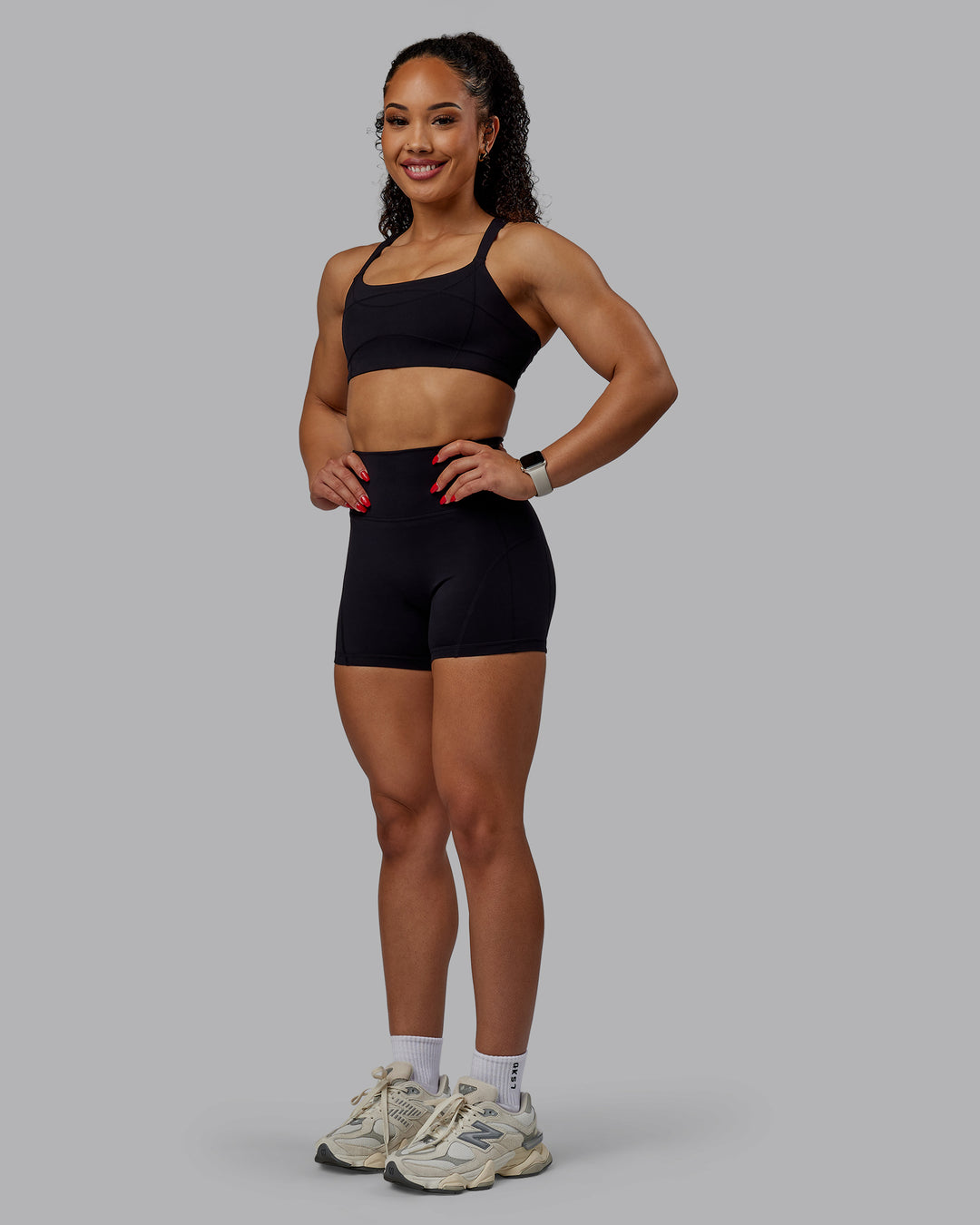 Woman wearing Inertia Sports Bra - Black