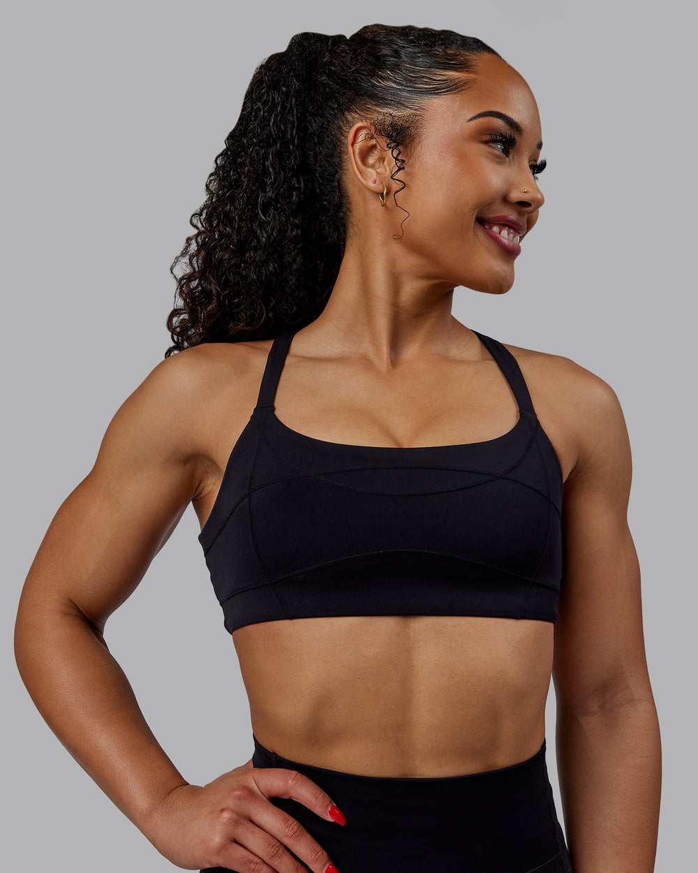 Woman wearing Inertia Sports Bra - Black