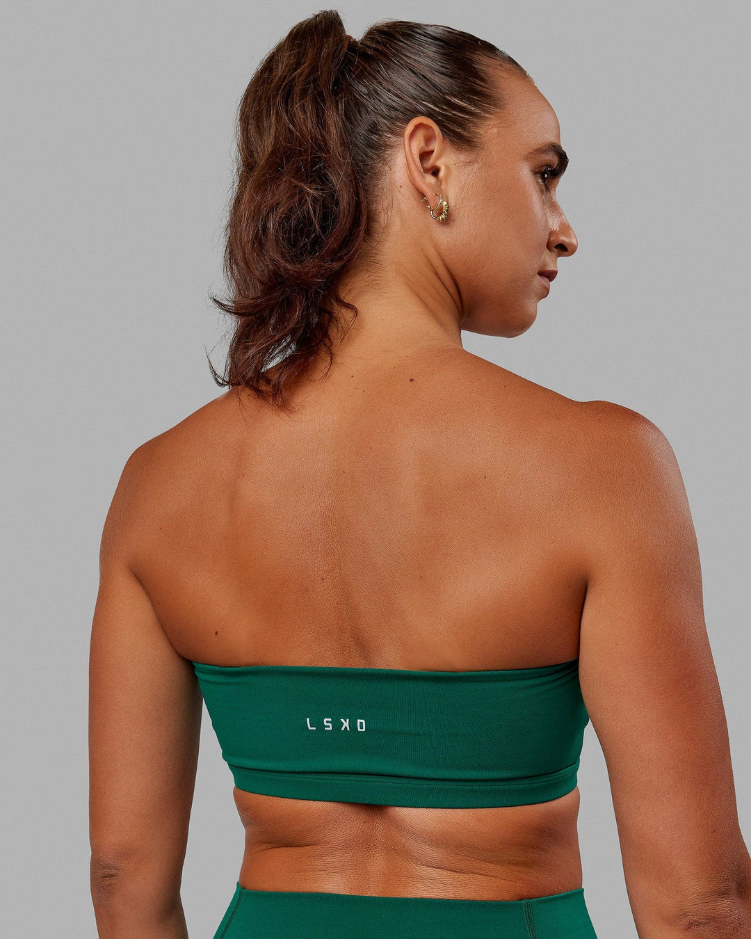 Woman wearing Inspire Sports Bra - Malachite