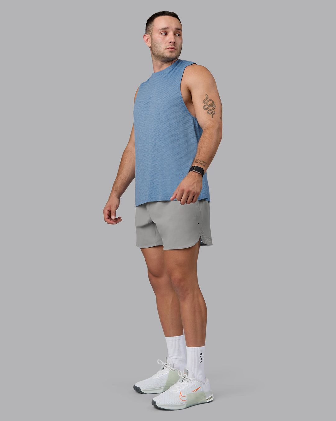 Man wearing Lift 6&quot; Lined Performance Shorts - Circular Grey