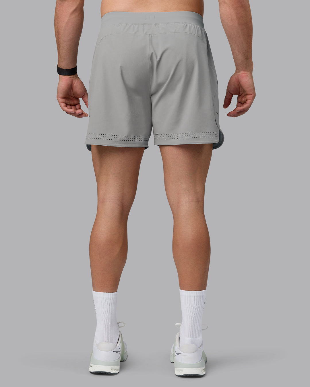 Man wearing Lift 6&quot; Lined Performance Shorts - Circular Grey