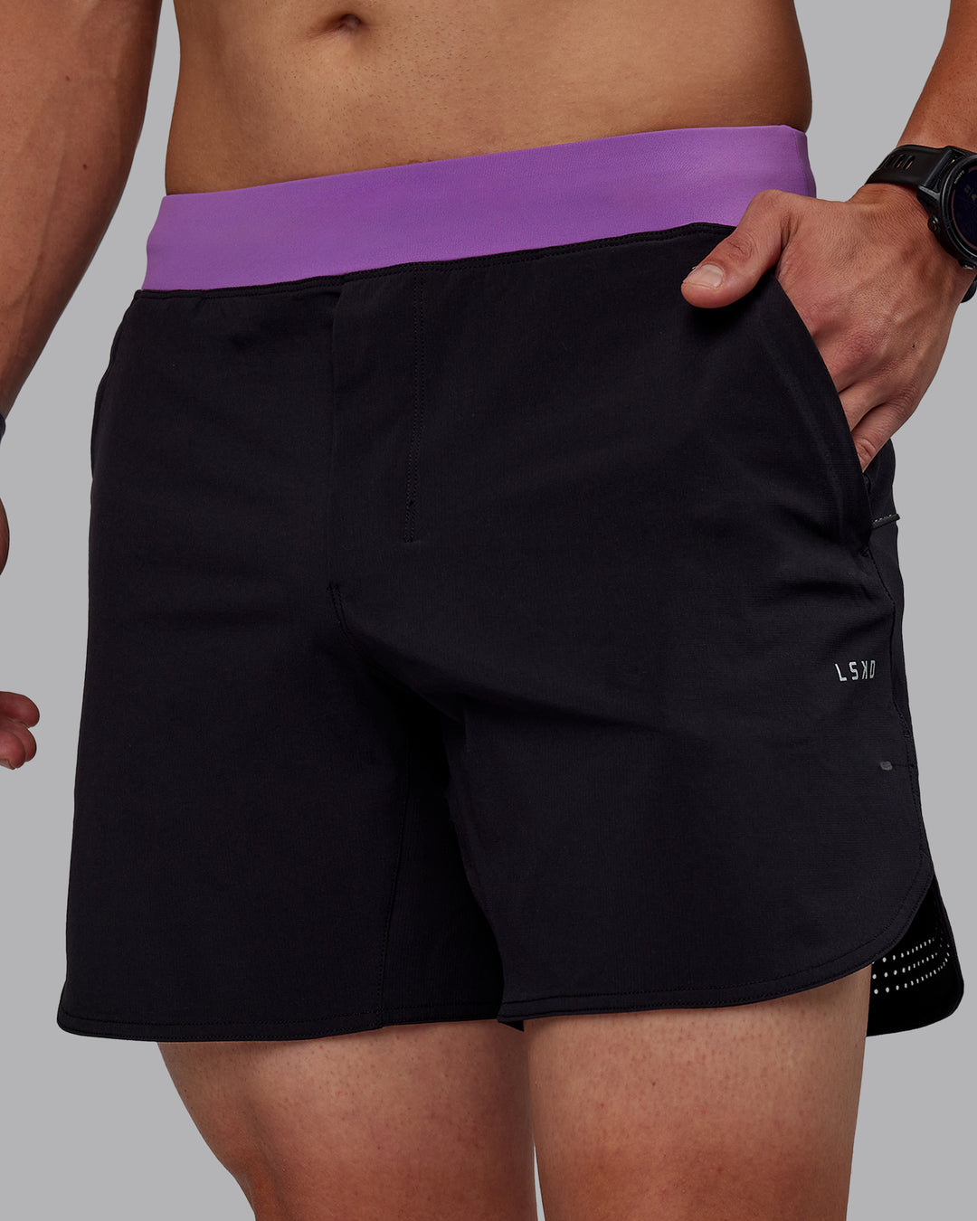 Man wearing Miami25 Lift 6&quot; Performance Shorts - Black-Purple Swirl