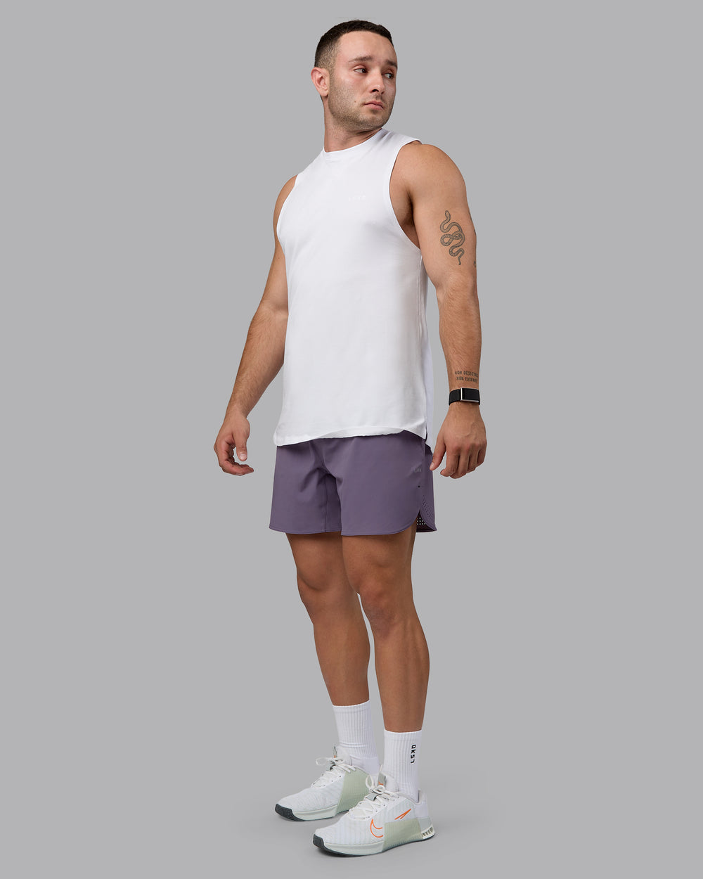 Man wearing Lift 6" Performance Shorts - Purple Sage