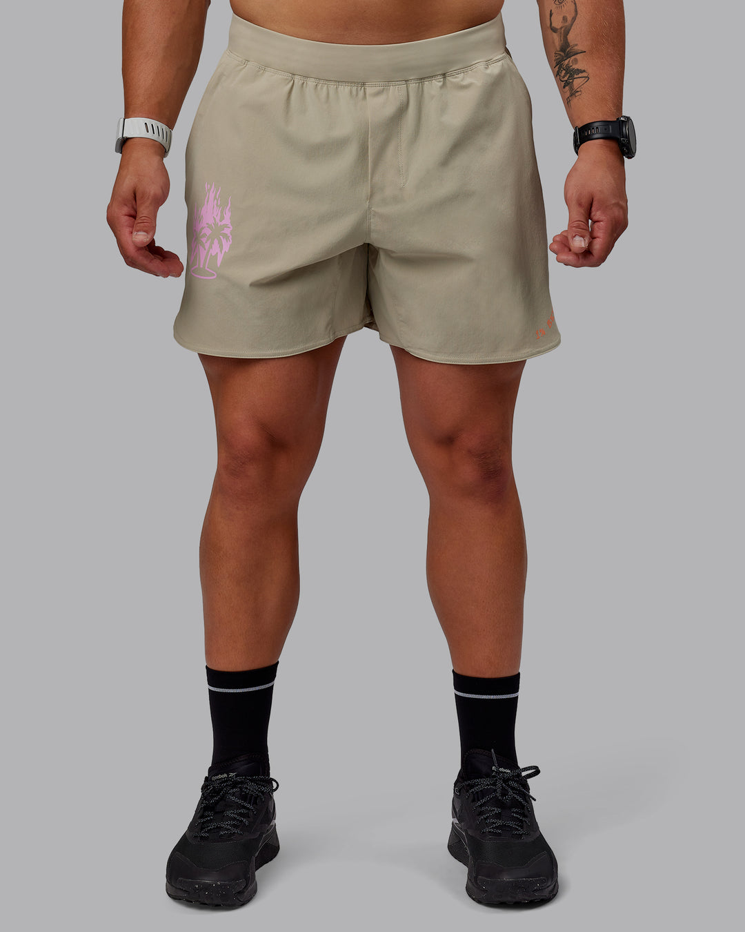 Man wearing Lift 6&quot; Performance Shorts - Sand-So Cal 24