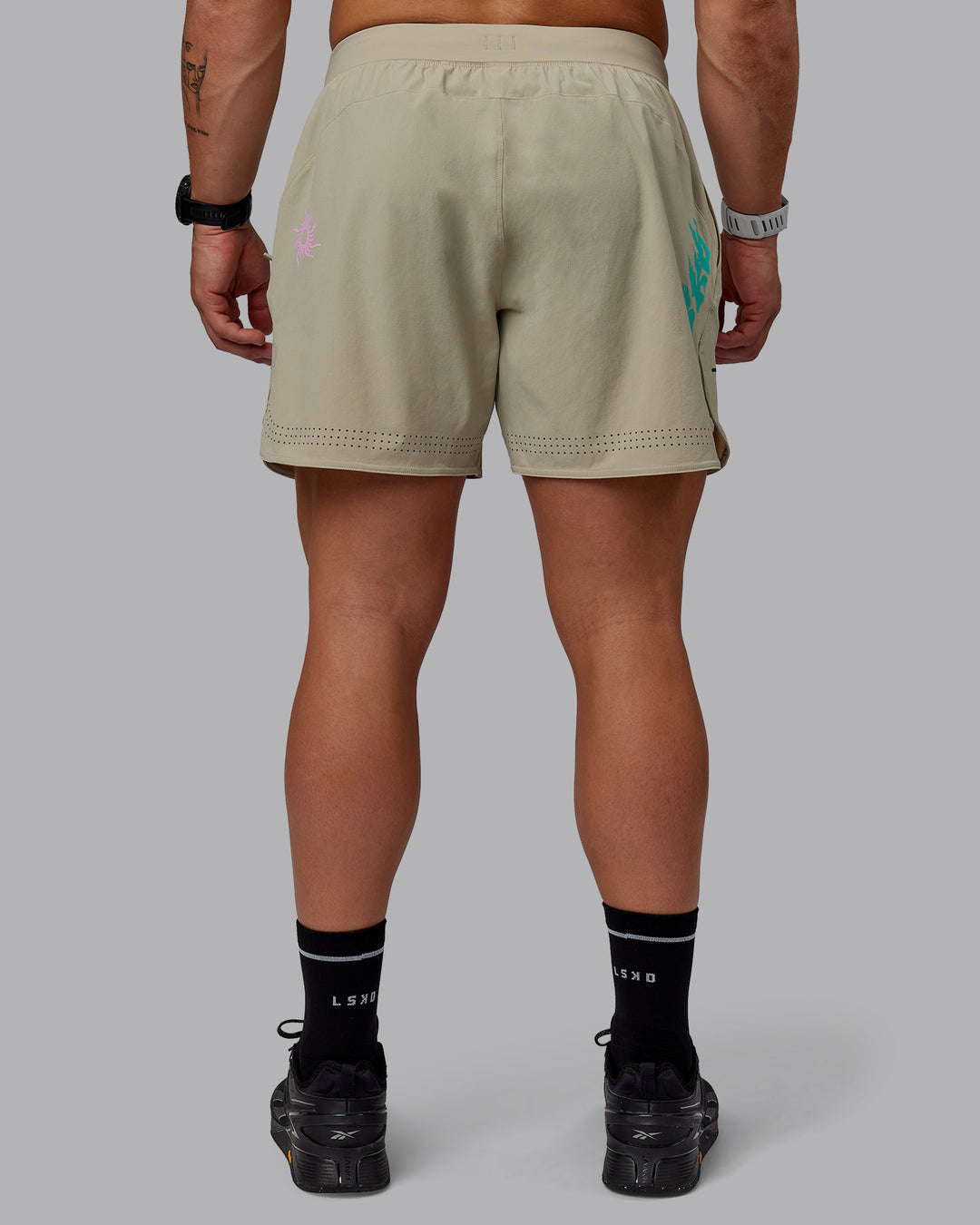 Man wearing Lift 6&quot; Performance Shorts - Sand-So Cal 24