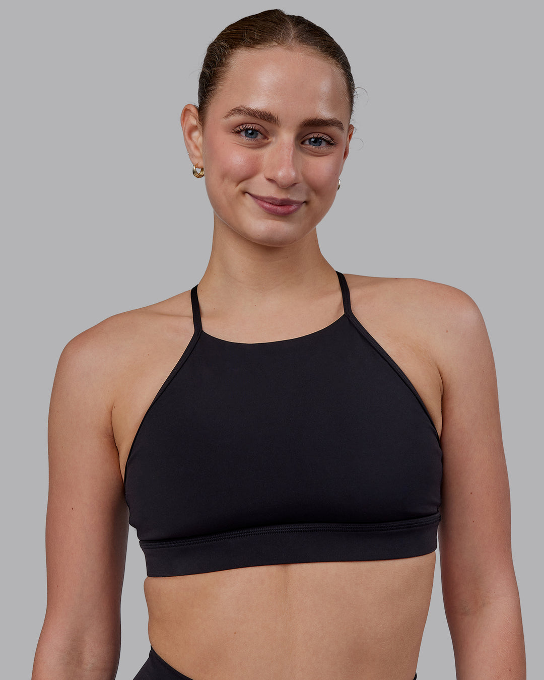 Woman wearing Lift High Neck Sports Bra - Black