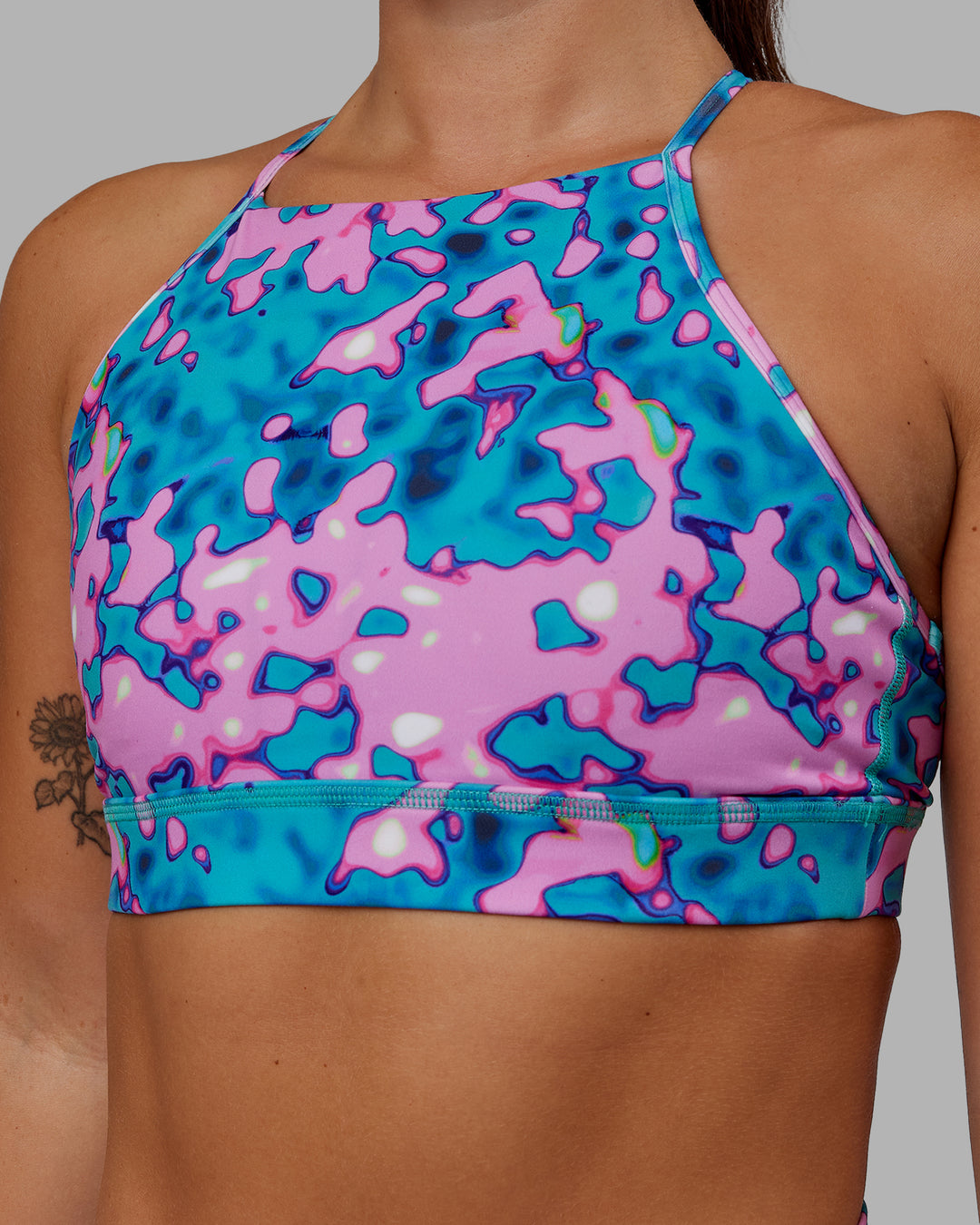 Woman wearing Lift High Neck Sports Bra - Neon Camo