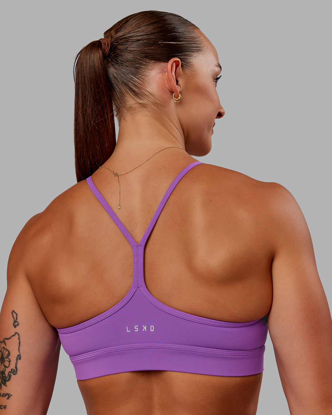 Woman wearing Lift High Neck Sports Bra - Purple Fizz