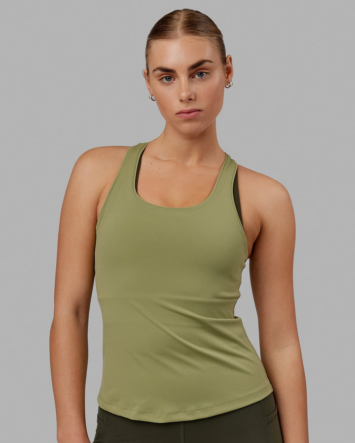 Woman wearing Lift Performance Tank - Moss Stone
