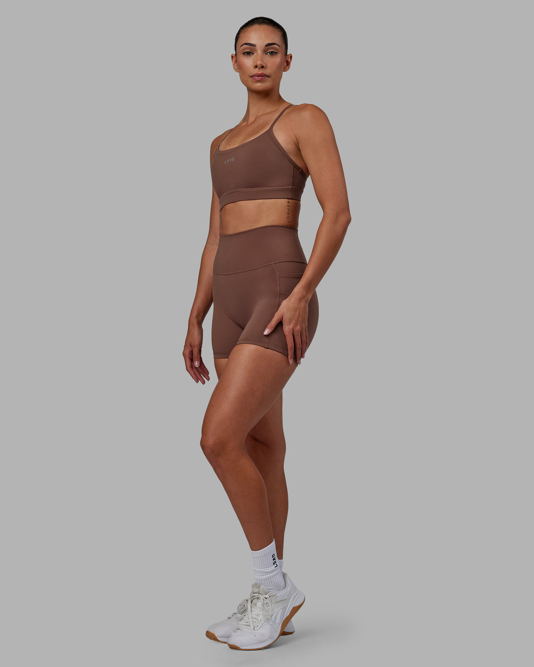 Woman wearing Lift Sports Bra - Dull Rust