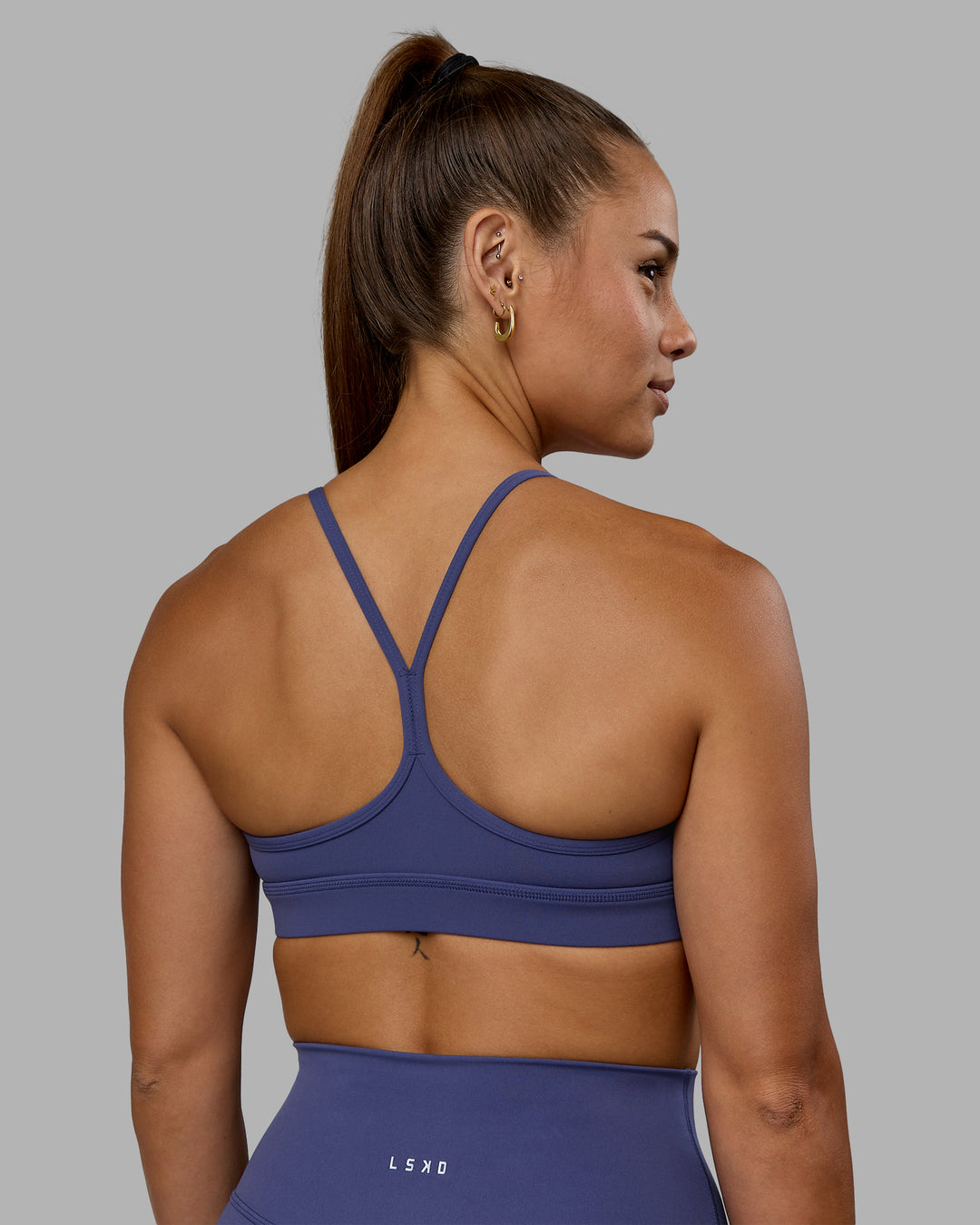 Woman wearing Lift Sports Bra - Future Dusk