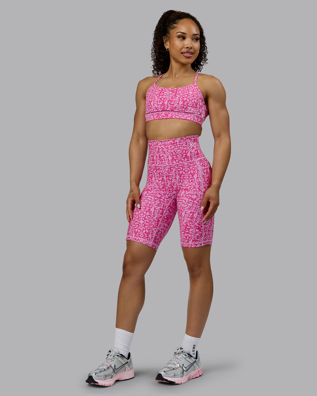 Woman wearing Lift Sports Bra - Patina-Ultra Pink