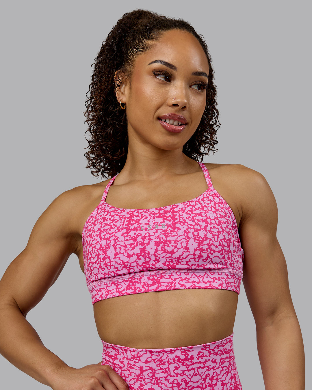 Woman wearing Lift Sports Bra - Patina-Ultra Pink