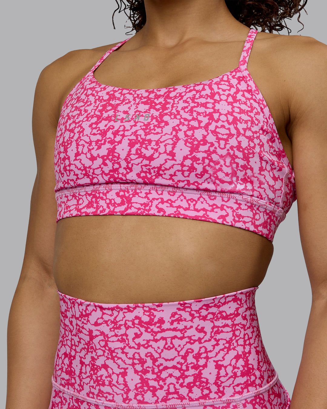 Woman wearing Lift Sports Bra - Patina-Ultra Pink