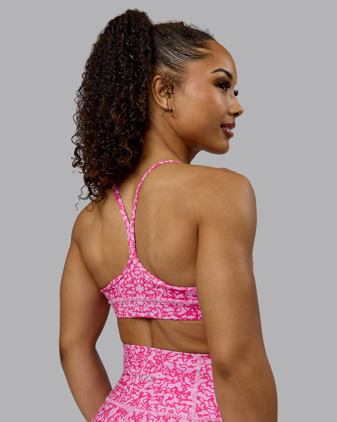 Woman wearing Lift Sports Bra - Patina-Ultra Pink