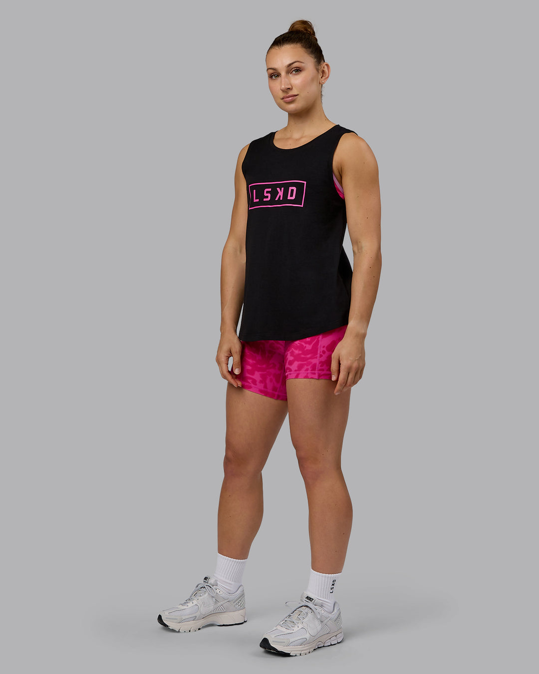 Woman wearing Luna FLXCotton Longline Tank - Black-Ultra Pink