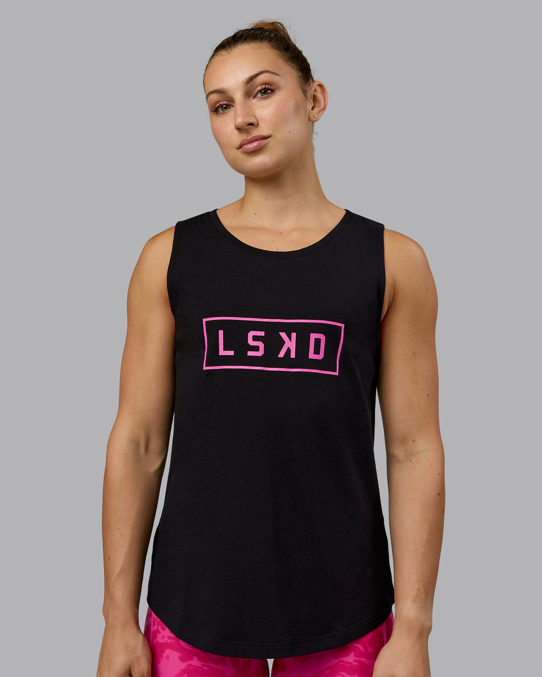 Woman wearing Luna FLXCotton Longline Tank - Black-Ultra Pink