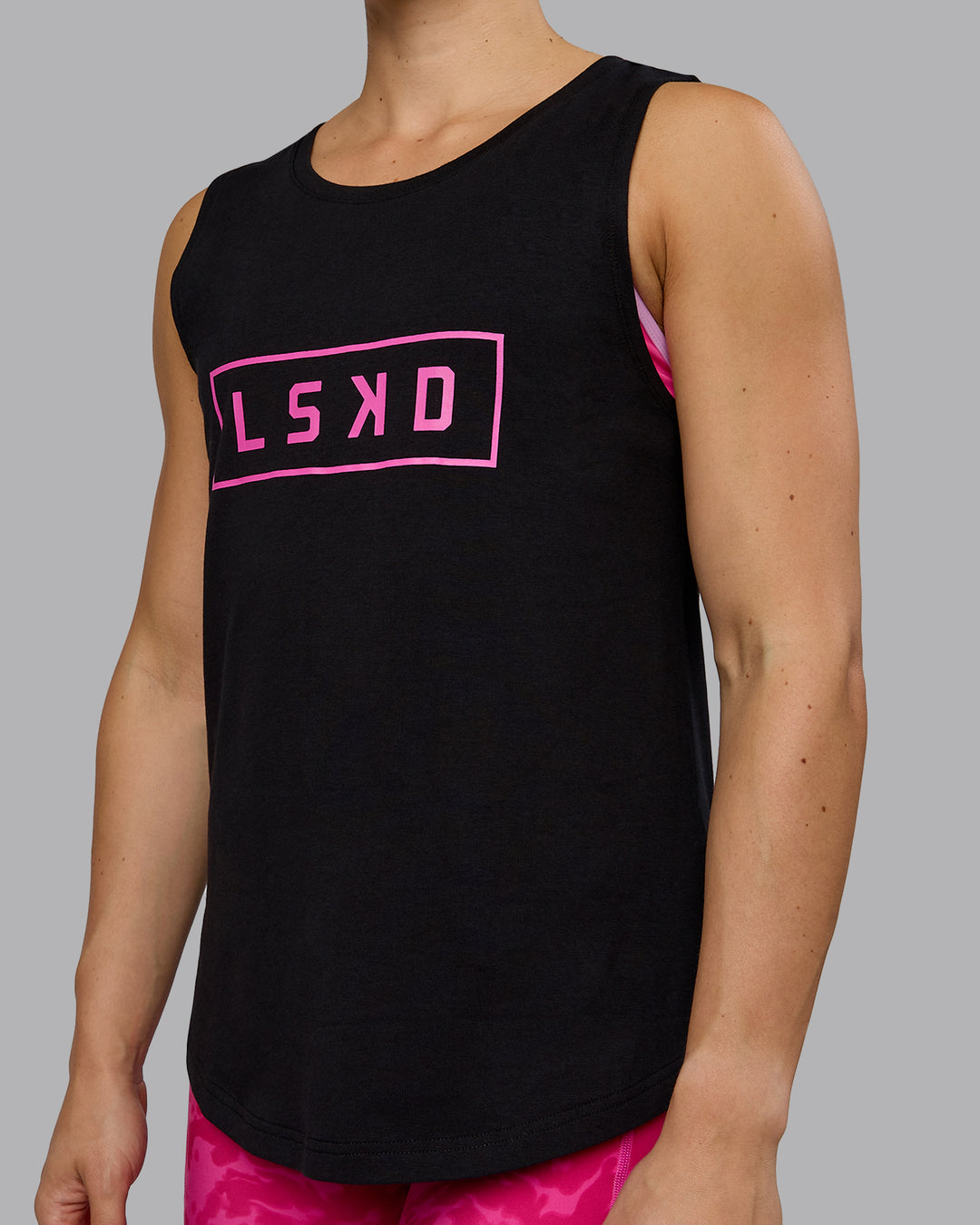 Woman wearing Luna FLXCotton Longline Tank - Black-Ultra Pink