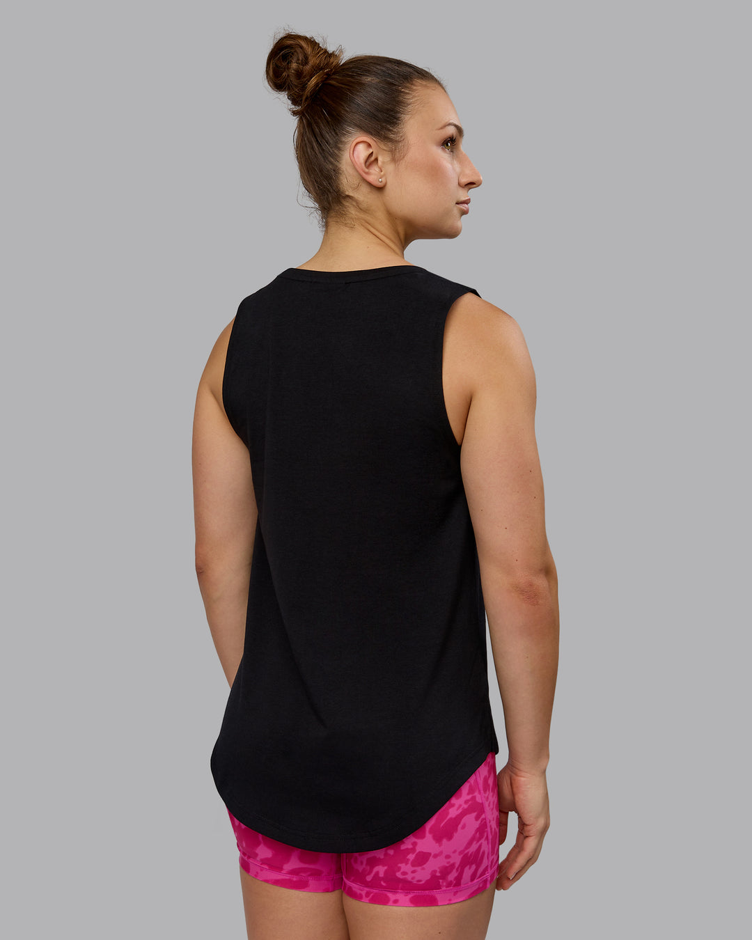 Woman wearing Luna FLXCotton Longline Tank - Black-Ultra Pink