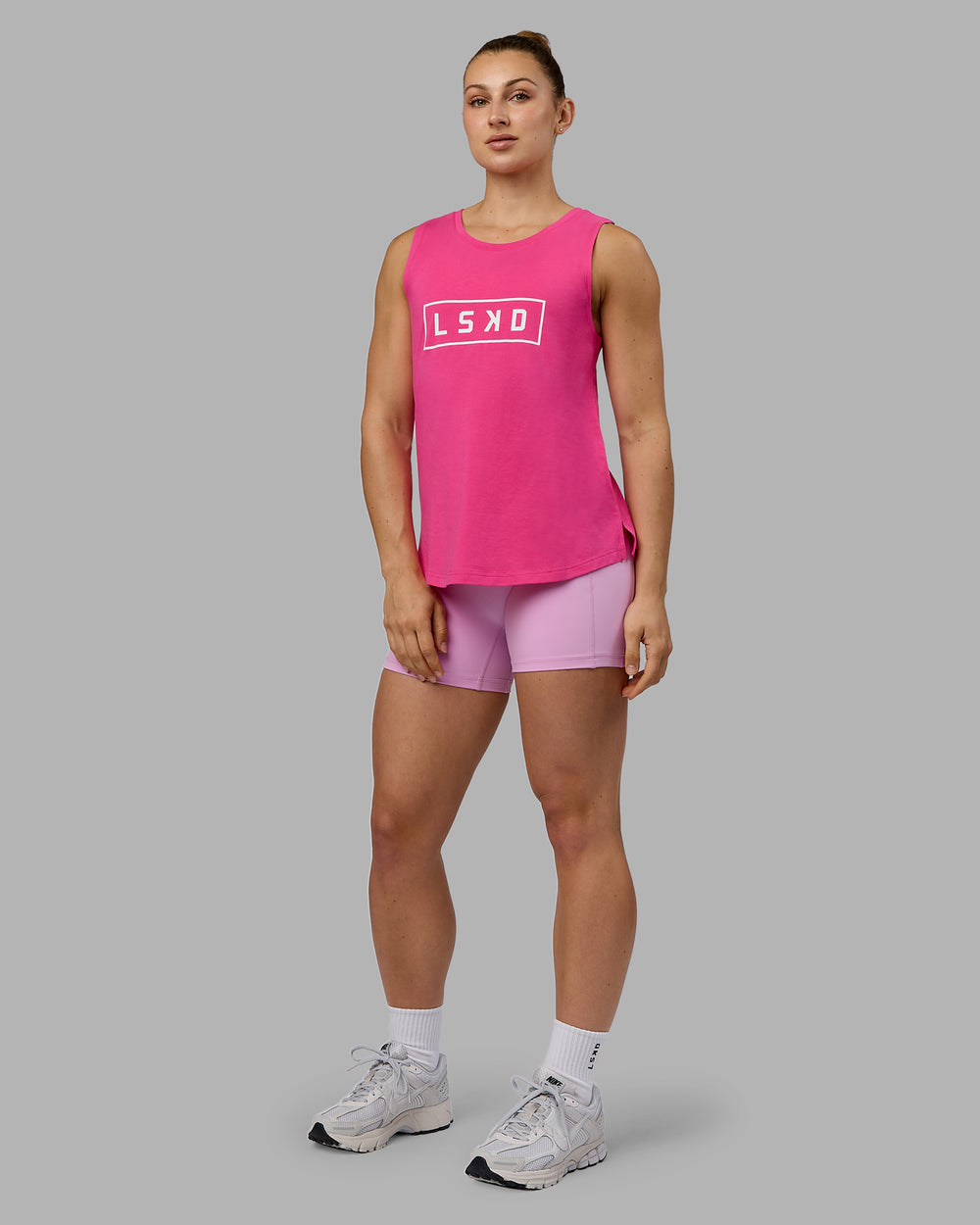 Woman wearing Luna FLXCotton Longline Tank - Ultra Pink-White