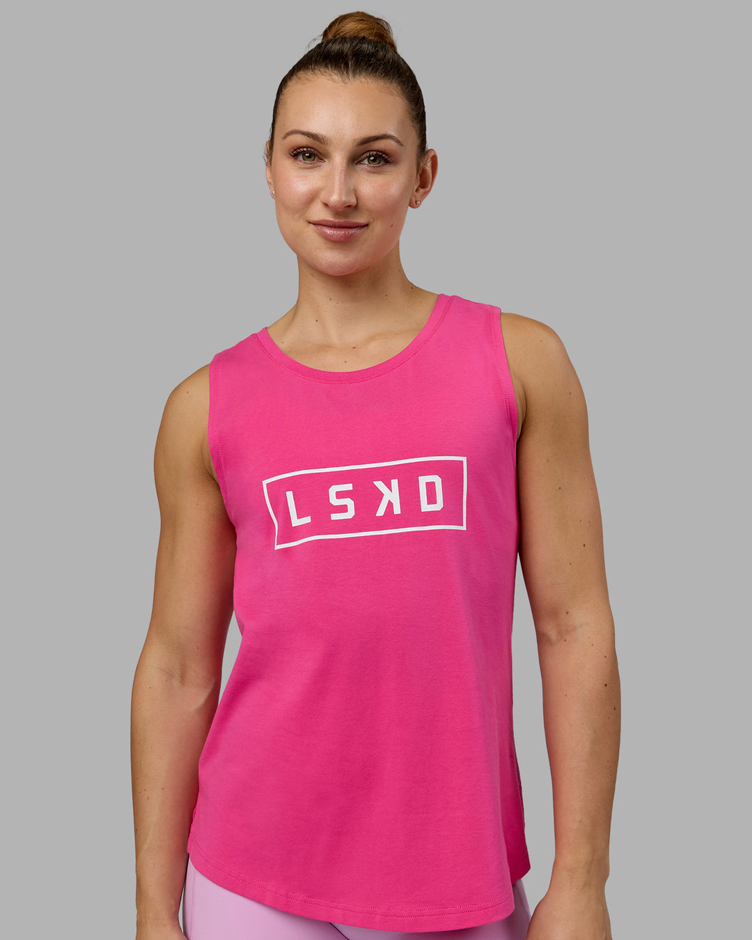 Woman wearing Luna FLXCotton Longline Tank - Ultra Pink-White