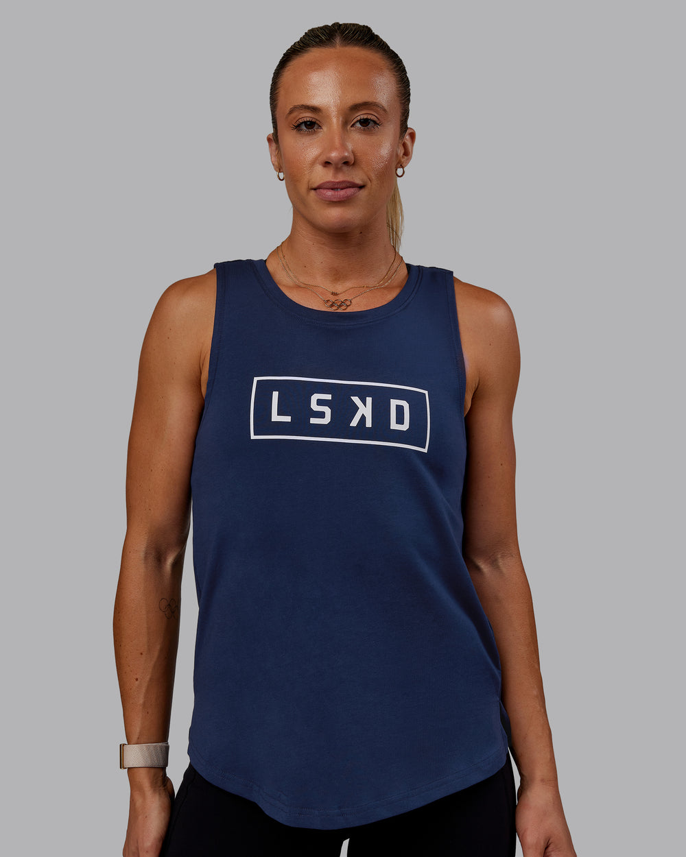 Woman wearing Luna FLXCotton Longline Tank - Future Navy-White