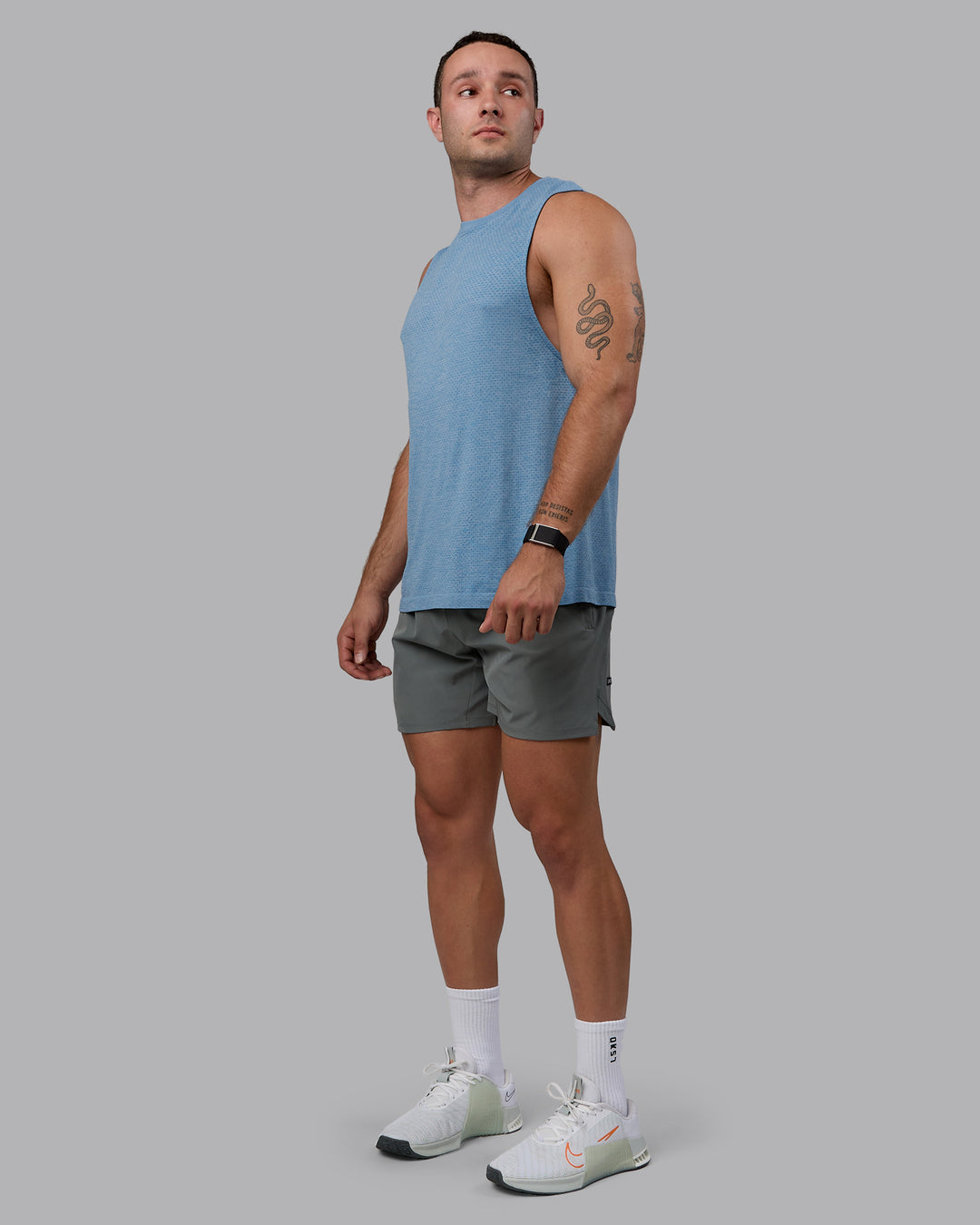 Man wearing AeroFLX+ Seamless Muscle Tank - Elemental Blue/Ice Blue