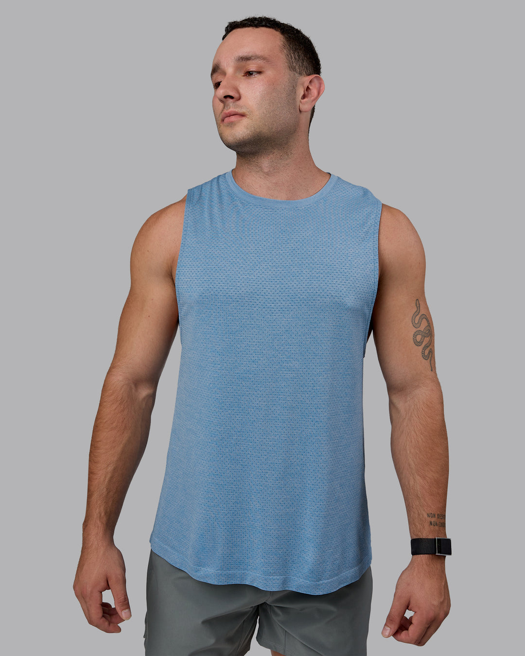 Man wearing AeroFLX+ Seamless Muscle Tank - Elemental Blue/Ice Blue