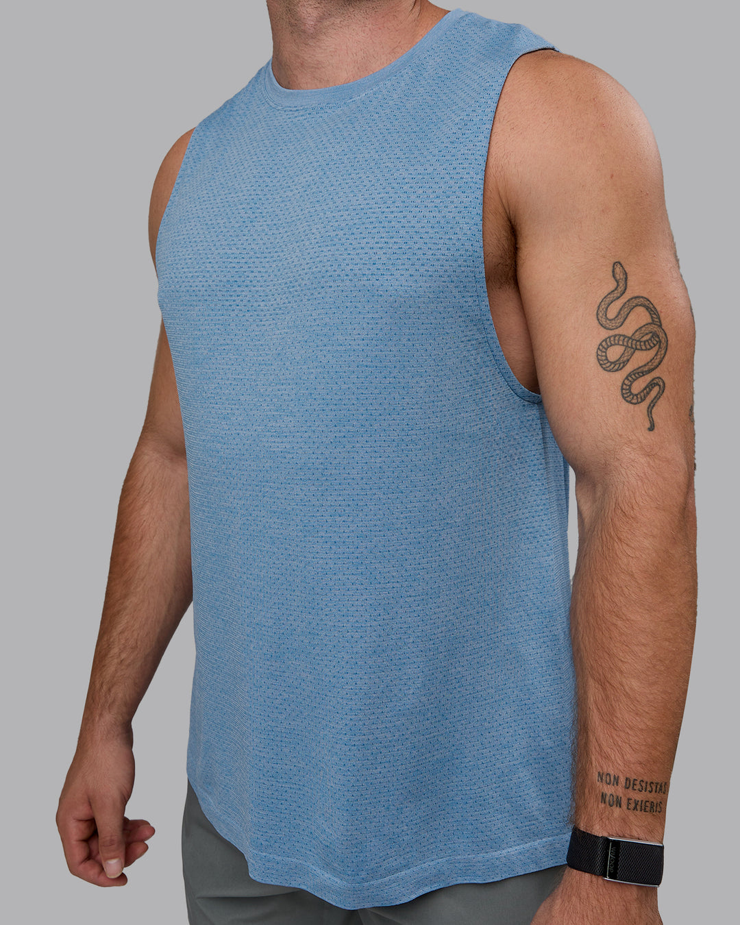 Man wearing AeroFLX+ Seamless Muscle Tank - Elemental Blue/Ice Blue