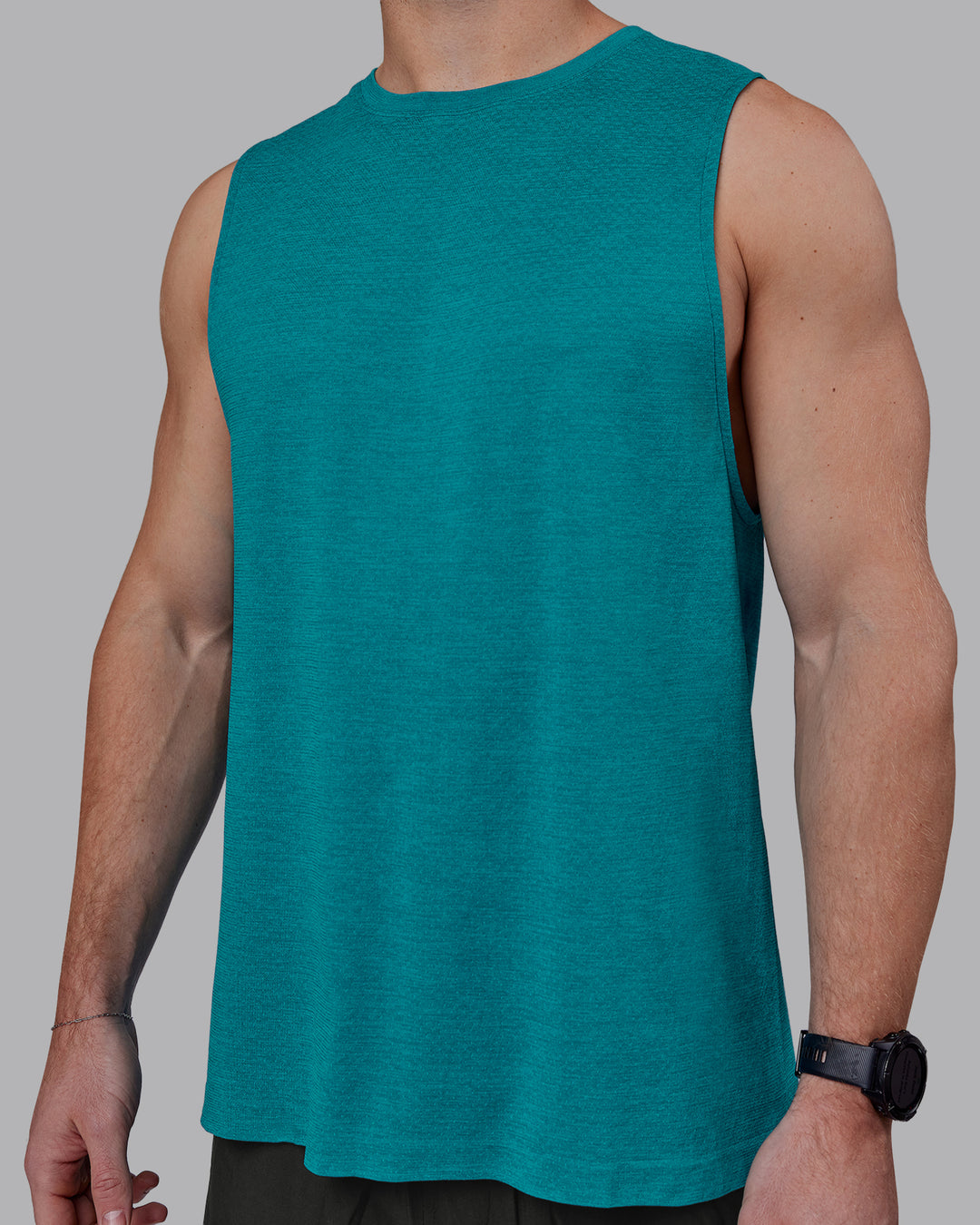 Man wearing AeroFLX+ Seamless Muscle Tank - Blue Bird Marl