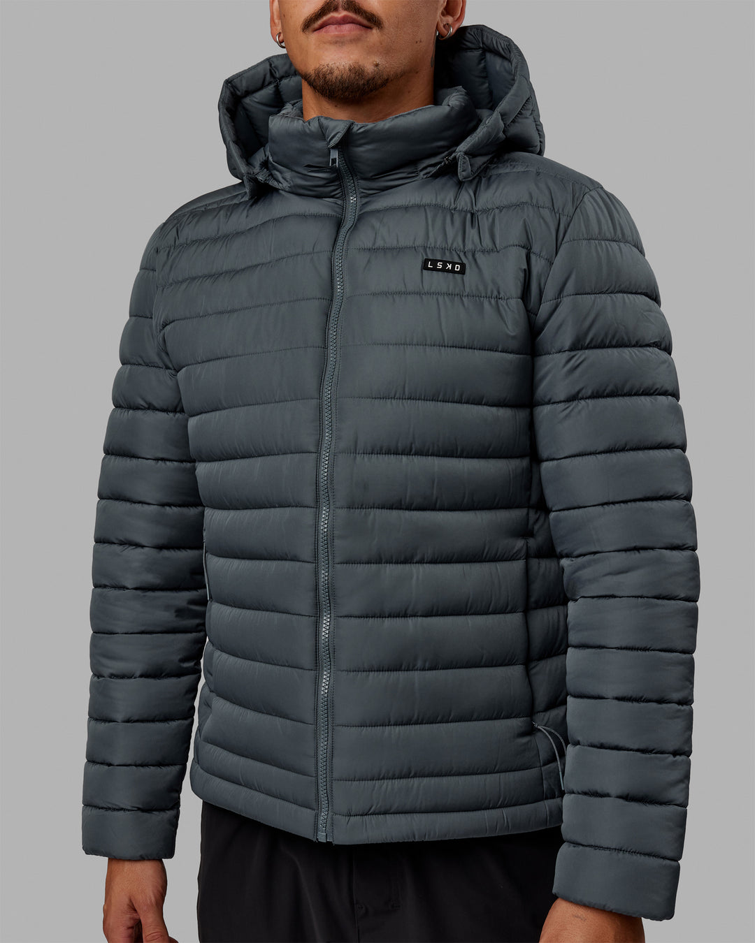 Man wearing All Day Puffer Jacket - Storm