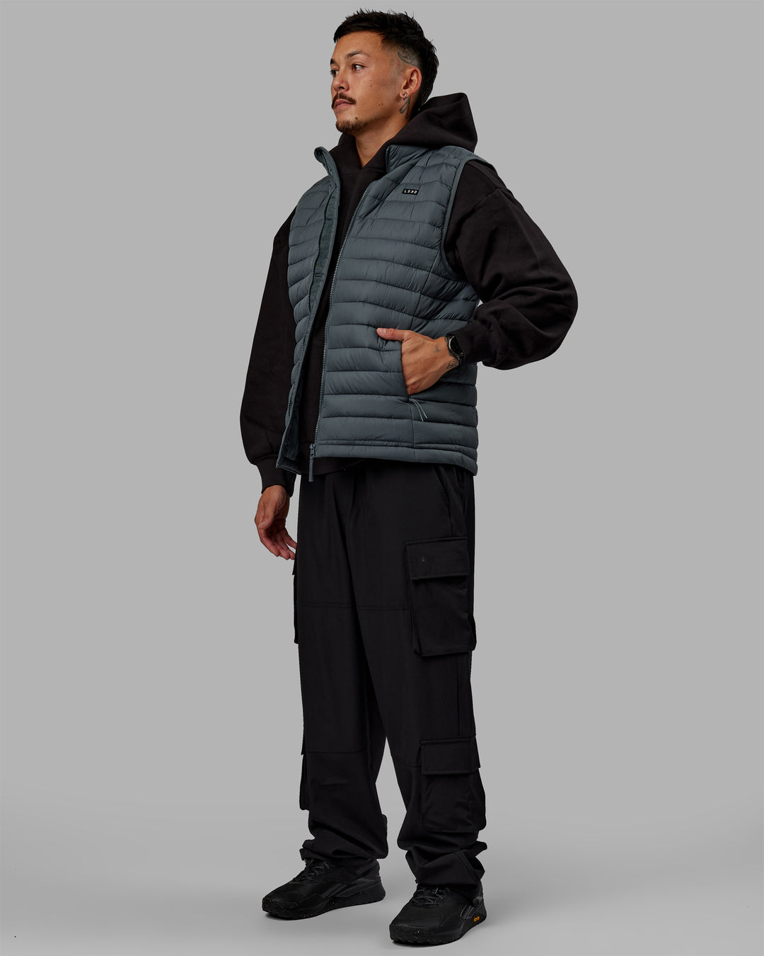 Man wearing All Day Puffer Vest - Storm