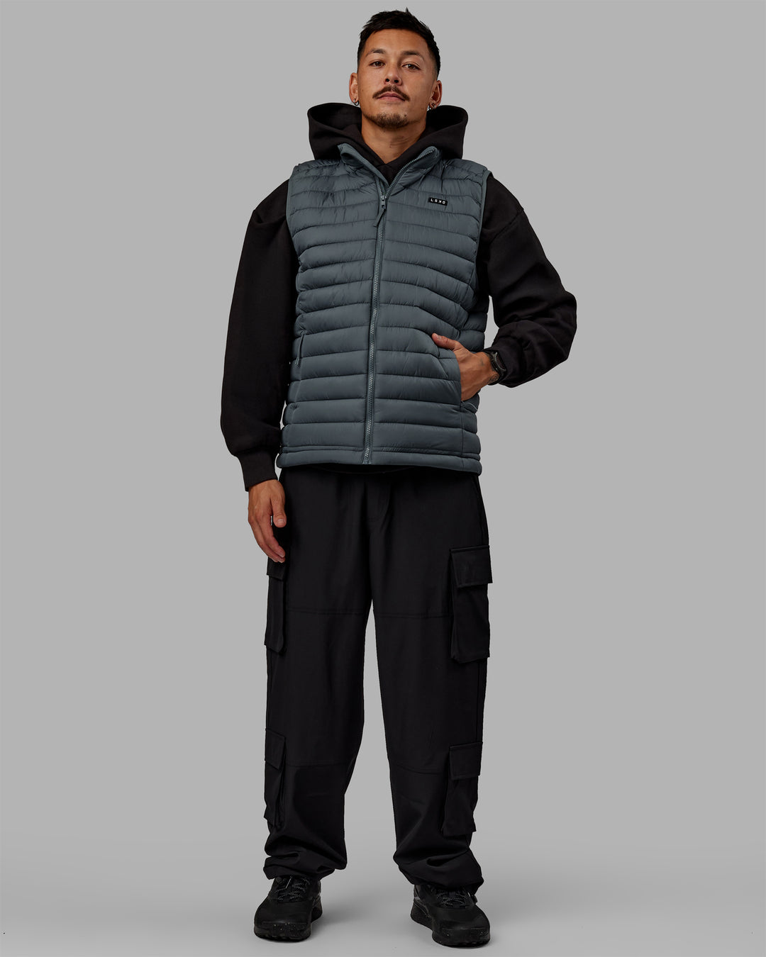 Man wearing All Day Puffer Vest - Storm