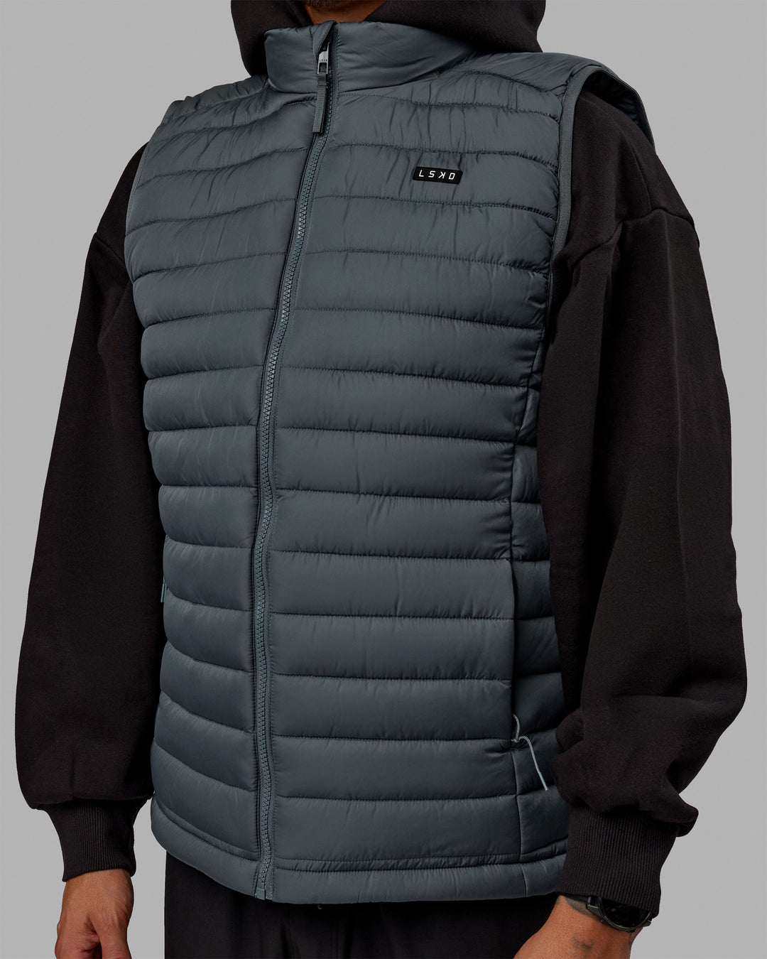 Man wearing All Day Puffer Vest - Storm