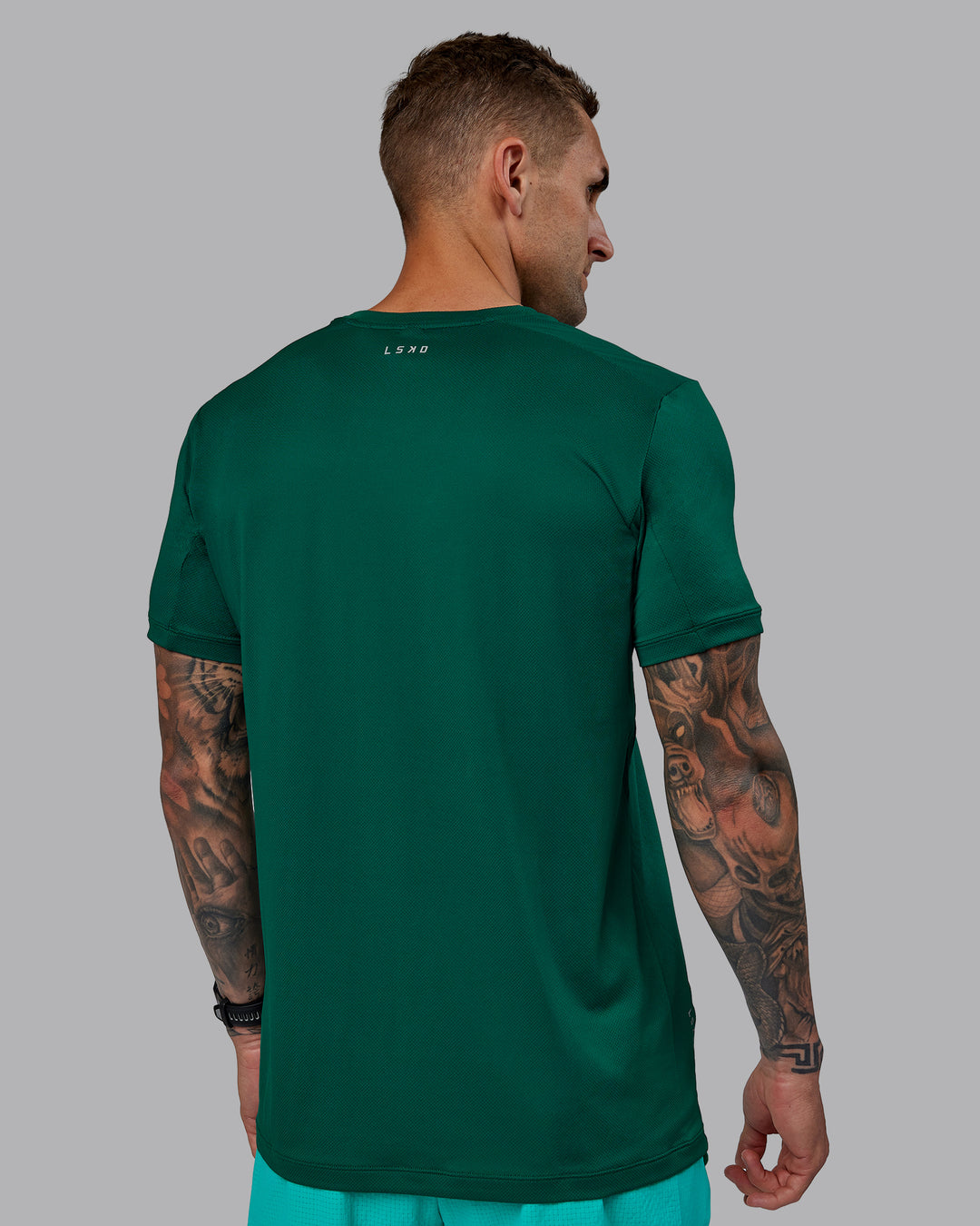 Man wearing Pace Running Tee - Malachite