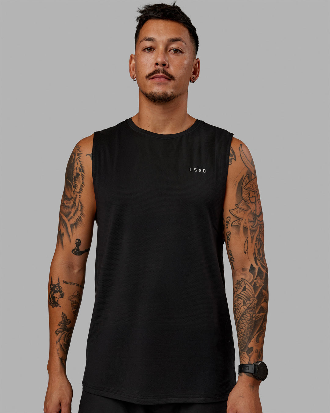 Man wearing Perform VapourFLX Muscle Tank - Black-Reflective