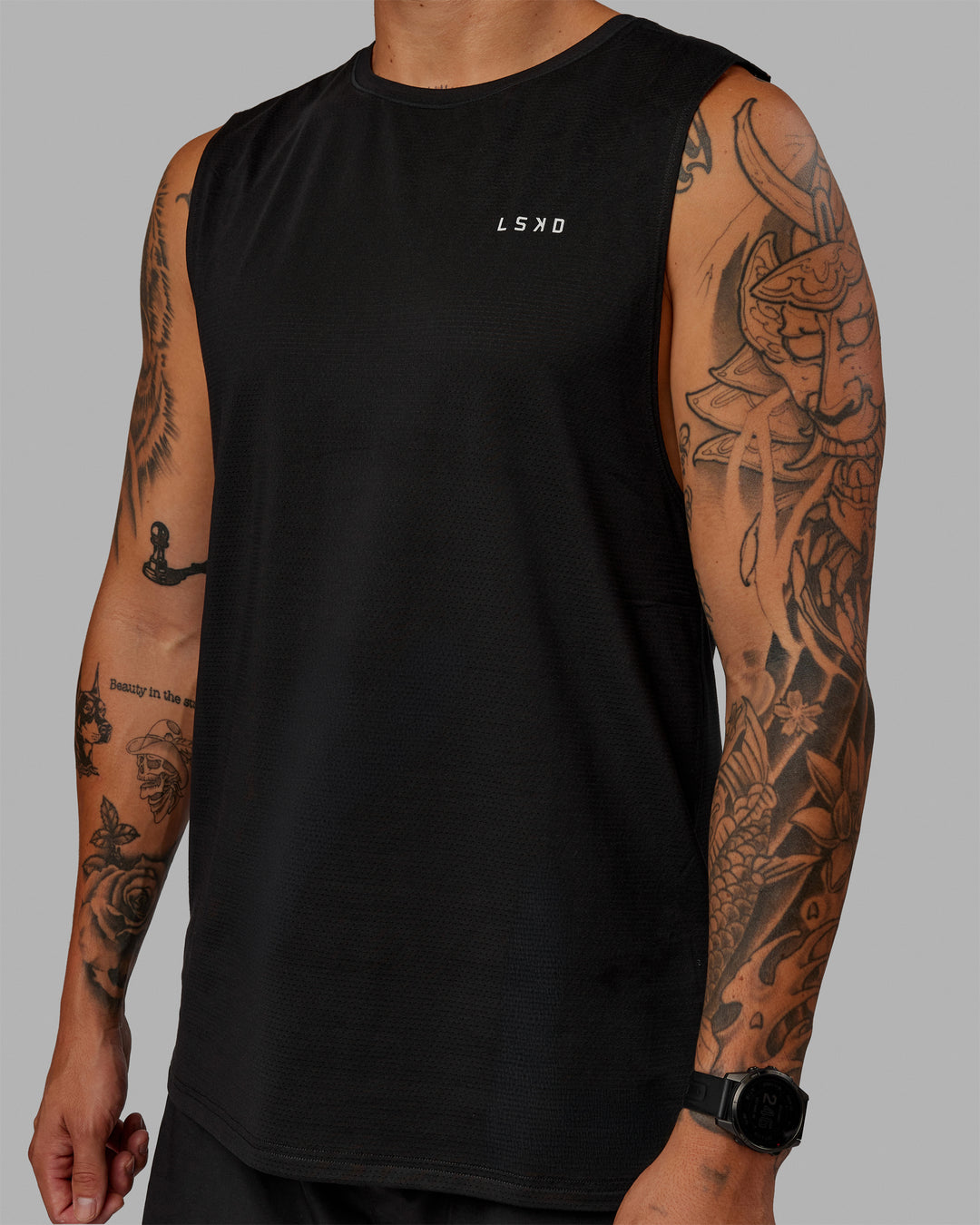 Man wearing Perform VapourFLX Muscle Tank - Black-Reflective