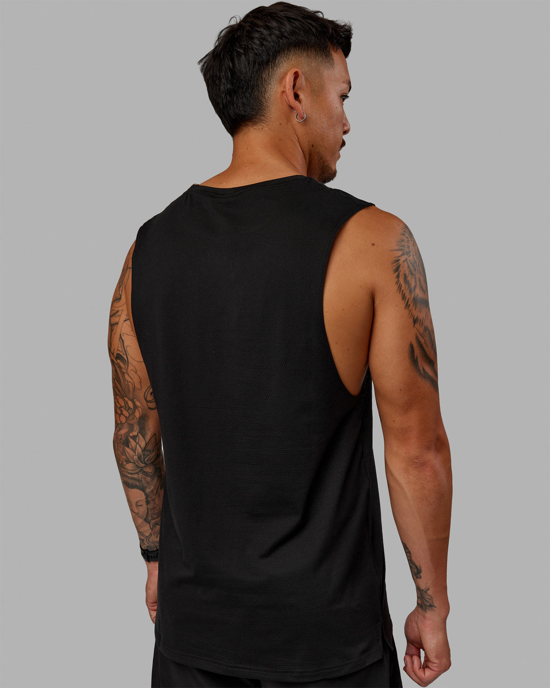 Man wearing Perform VapourFLX Muscle Tank - Black-Reflective