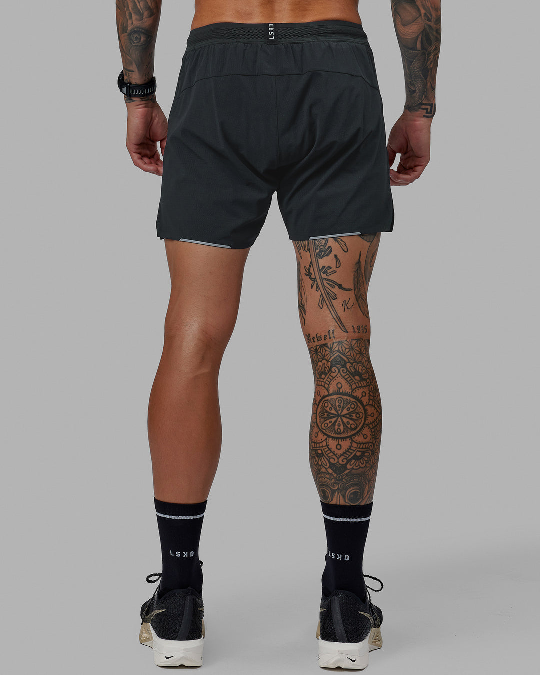 Man wearing UltraAir 5&quot; Lined Performance Shorts - Pirate Black