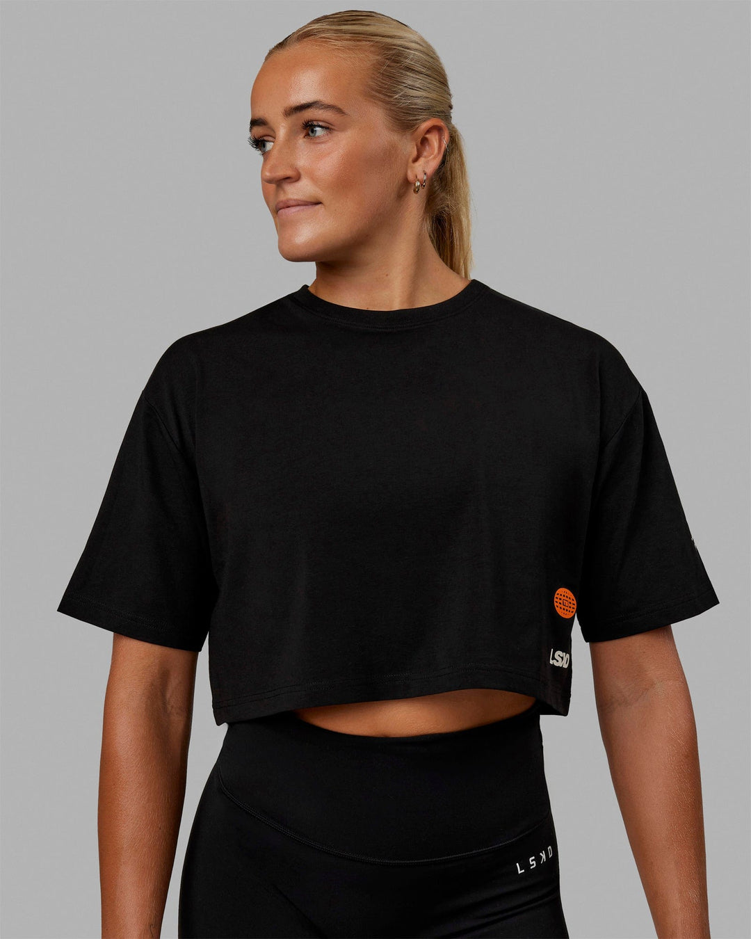 Woman wearing Millennium FLXCotton Cropped Tee - Black