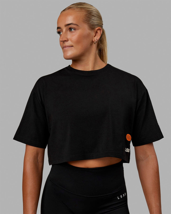 Woman wearing Millennium FLXCotton Cropped Tee - Black
