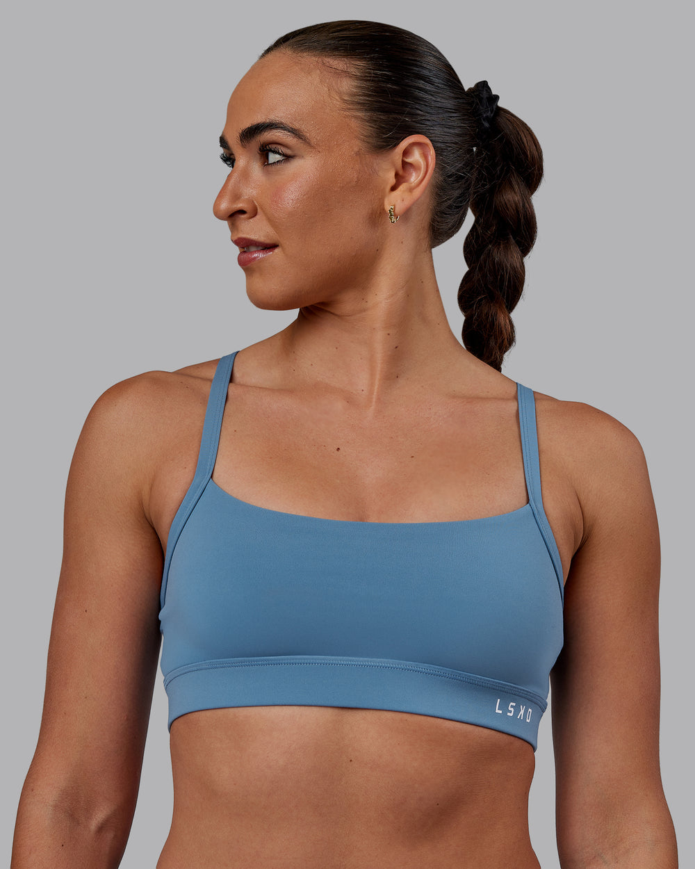 Woman wearing Momentum Sports Bra - Elemental Blue