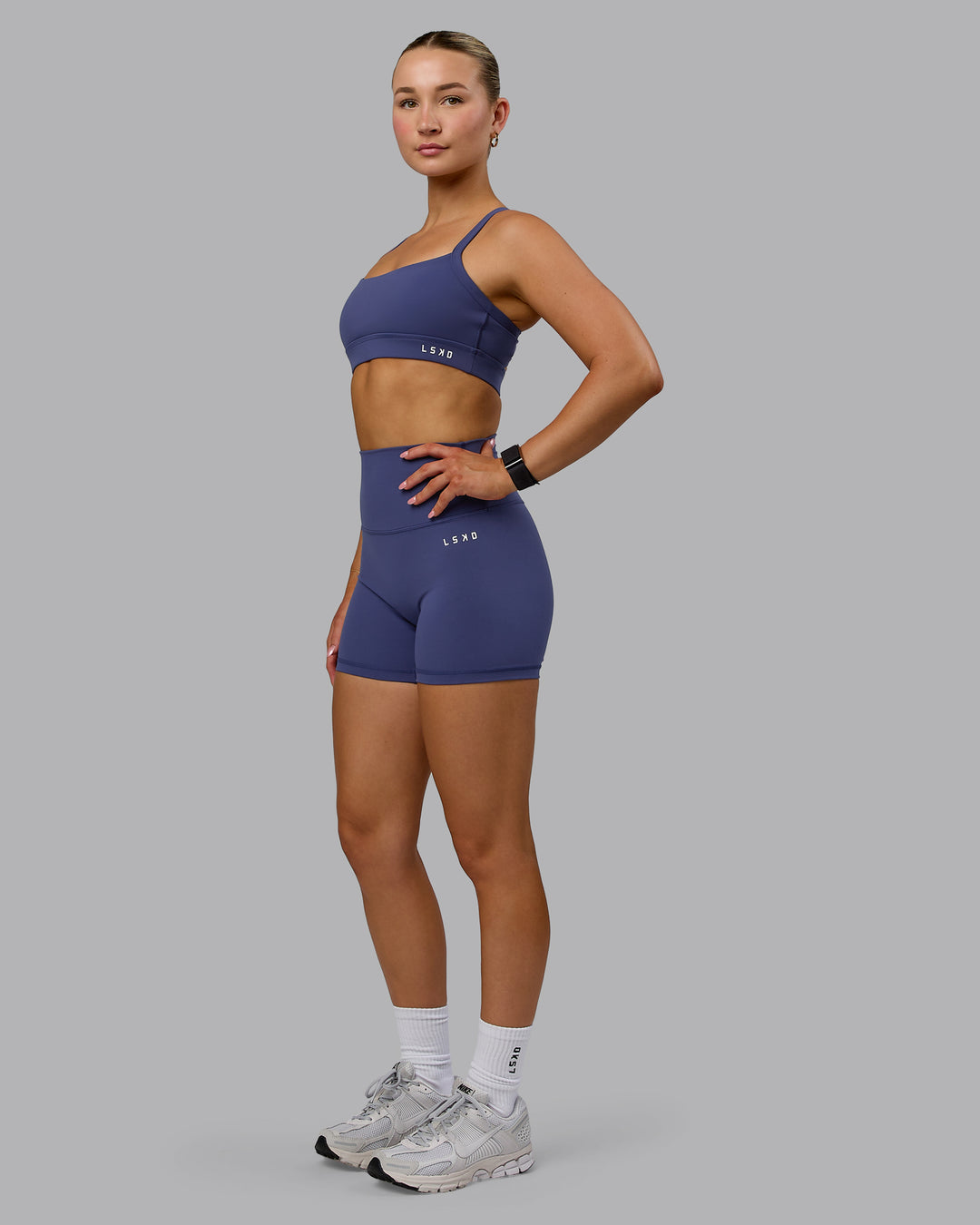 Woman wearing Momentum Sports Bra - Future Dusk