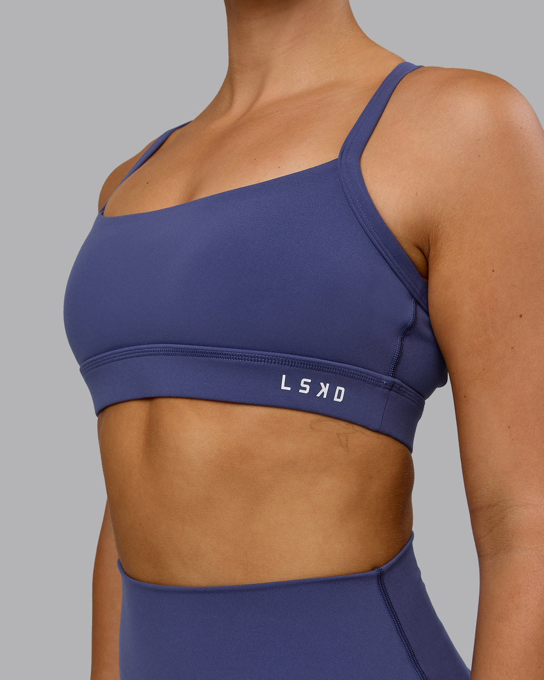 Woman wearing Momentum Sports Bra - Future Dusk