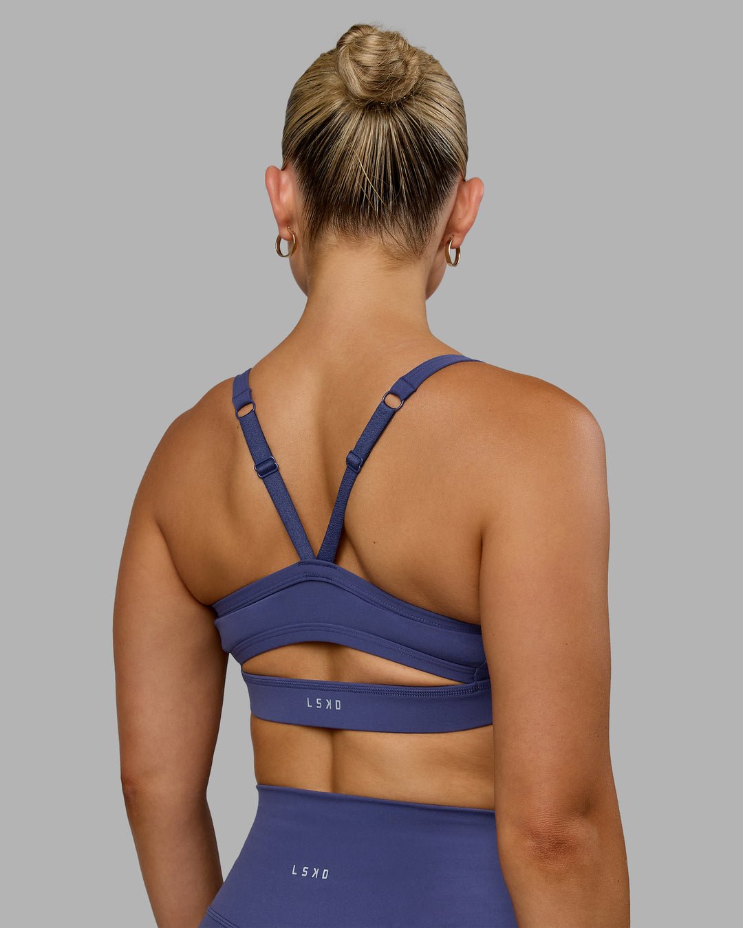 Woman wearing Momentum Sports Bra - Future Dusk