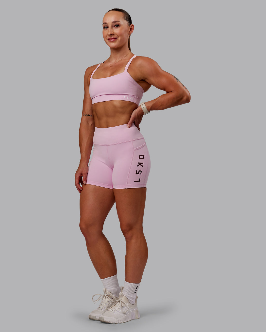 Woman wearing Momentum Sports Bra - Marshmallow