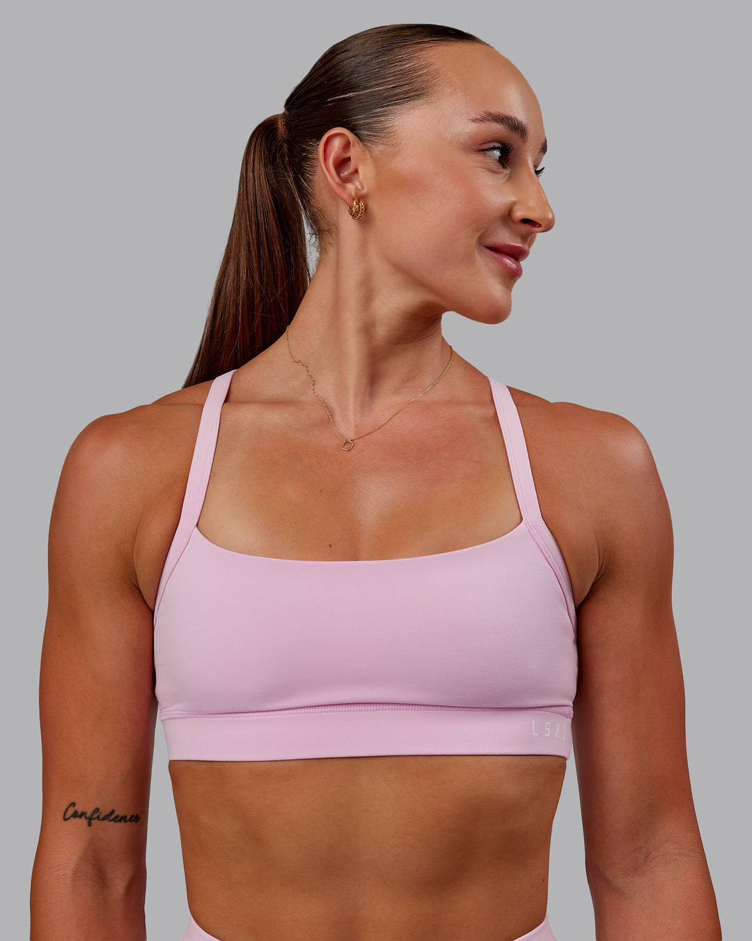 Woman wearing Momentum Sports Bra - Marshmallow